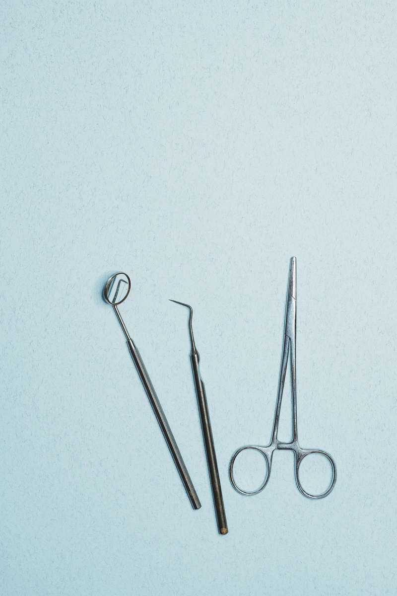 Dental Tools on Blue Surface